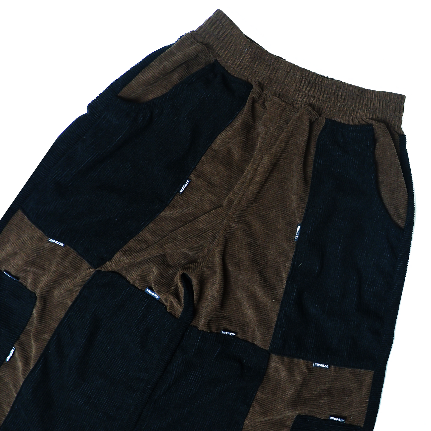"PATCHWORK UTILITY PANTS, (2/2)."